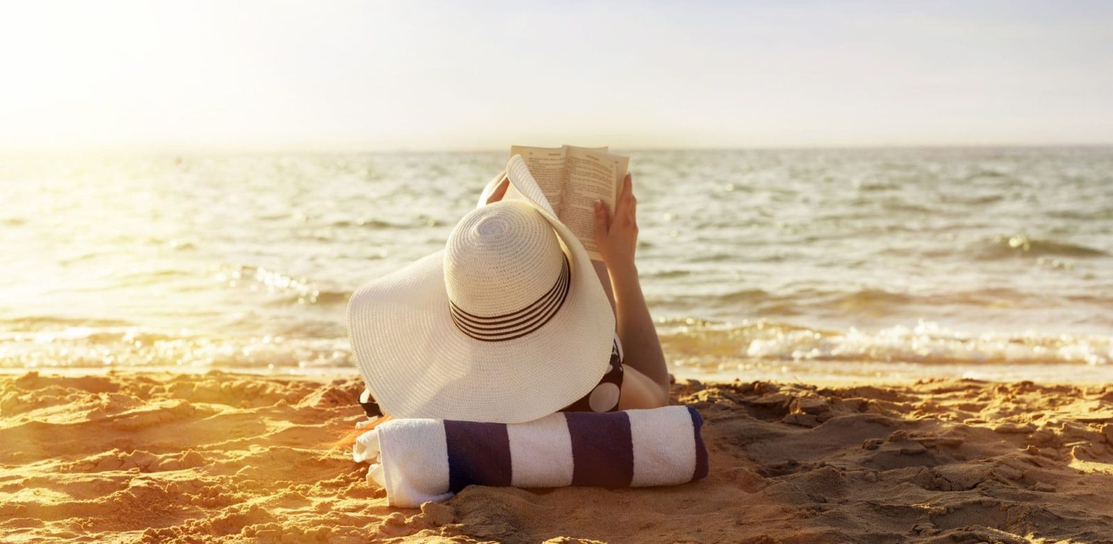 women reading on the beach